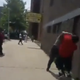 A plainclothes NYPD officer and Saykou George (in red) in Harlem on July 1, 2015
YouTube screenshot